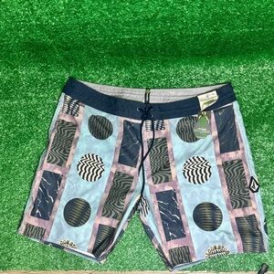 Volcom Blue and Pink Board Shorts with Geometric Design